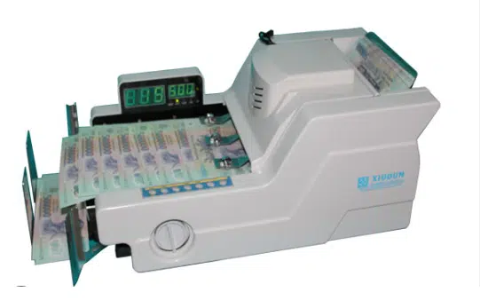 Máy đếm tiền chính hãng là gì? Nguồn gốc và vai trò của máy đếm tiền Xiudun 2012W